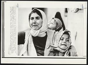 Desolate at Earthquake's Desolation--A woman and her daughter cannot hold back their tears Tuesday, seeing the destruction around them caused by Saturday's earthquake at Gediz, Turkey, that claimed the lives of at least 925 persons.