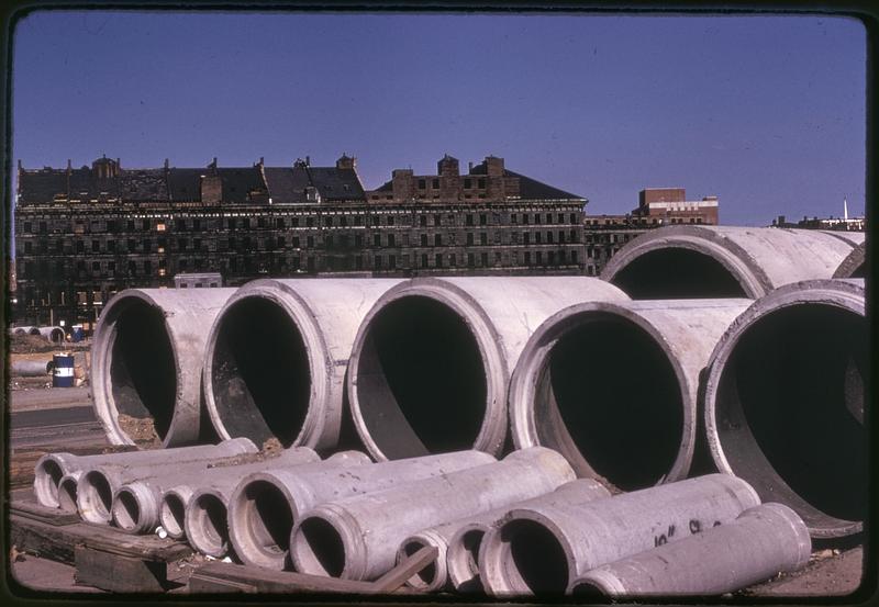 Construction pipes, Mercantile Wharf building in background