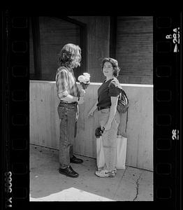 Couple meets with flowers, Boston