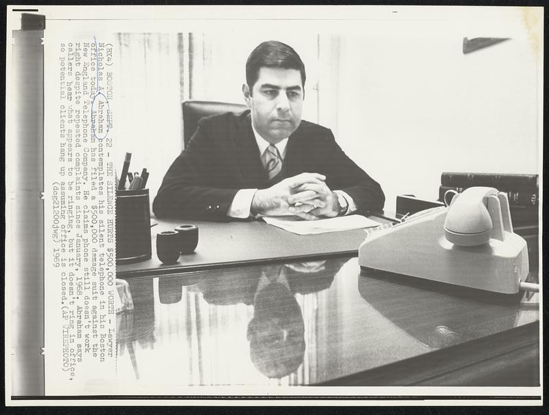 The Silence Hurts $500,000 Worth - Lawyer Nicholas A. Abraham contemplates his silent telephone in his Boston office today. Abraham has filed a $500,000 damage suit against the New England Telephone Company. He claims phone still doesn't work right despite repeated complaints since January, 1968. Abraham says callers hear what appears to be ringing, but it doesn't ring in office, so potential clients hang up assuming office is closed.