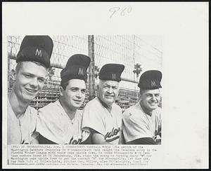 Topsy-Turvy Baseball World The switch of the Washington Senators franchise to Minneapolis-St Paul caught the Senators entry in the Florida Winter League with their caps upside down. So these Minneapolis St Paul team members based at St Petersburg, Fla. right the wrong by turning their "W" for Washington caps upside down to get the correct "M" for Minneapolis. L-R they are, Ray Buck S.S. of Philadelphia, pitcher Geo. Miller, also Philadelphia, Coach Joe Fitzgerald and catcher Joe McCabe, Lebanon, Pa.