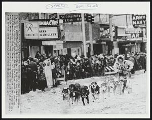 Eastern Musher Wins World Championship -- Dr. Roland Lombard, 59, of Wayland, Mass., drives his dog sled team through the streets of Anchorage during the first round of the 1971 World Championship Sled Dog Races. Dr. Lombard, the oldest competitor, won his seventh World Championship Sunday with the lowest total running time for the three rounds.