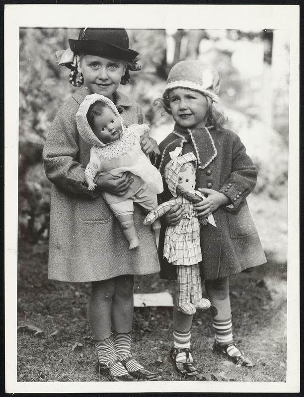 The dolls are part of the family so they, too, must join with Helen Louise, 4, left, and Carol Ann, 21/2, small daughters of Mayor-elect Maurice J. Tobin, in celebrating daddy's victory at the polls Tuesday.