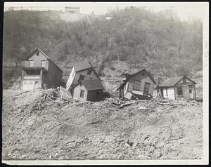 House Tumble in Landslide-Abandoned house at Aliquippa, Pa., tumbled into this position gradually from landslides. They are near the site of a new highway construction project.