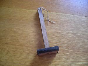 Wooden object with dark material