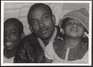 Closeup of a woman, a man, and a little girl