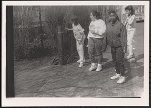 Group of four on the sidewalk