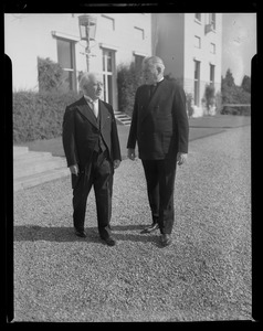 Man speaking with Rev. Cushing