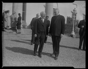 Man speaking with Rev. Cushing