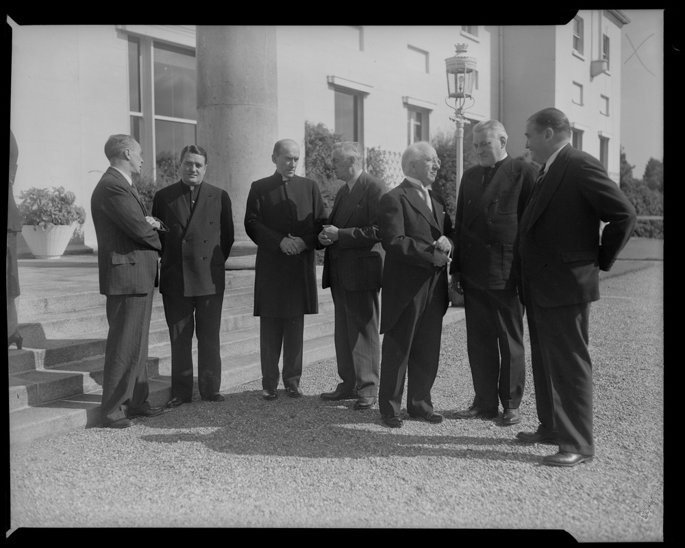 Group of men and clergy, including Rev. Cushing and Gov. Paul Dever