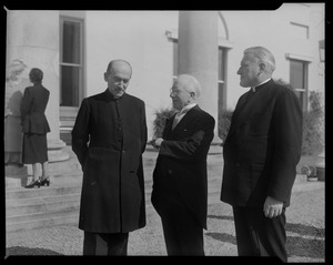 Men speaking with Rev. Cushing