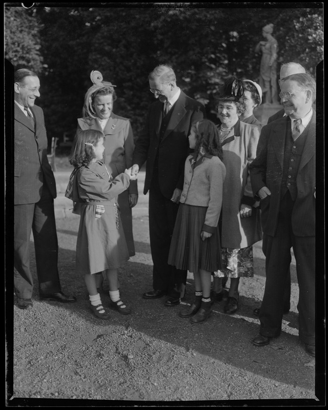 Man shaking hands with child - Digital Commonwealth