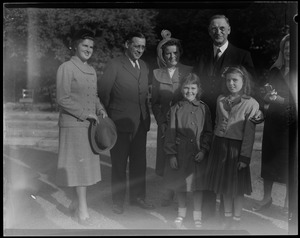 Group of adults with two young girls