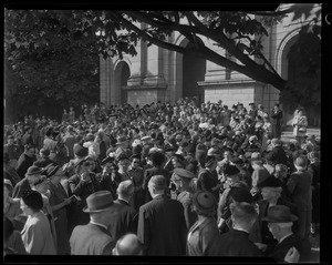 A crowd of people standing outside a church