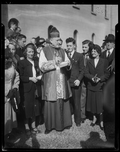 Rev. Cushing stands among a crowd