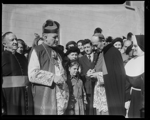 Rev. Cushing standing with another member of the clergy in front of a crowd