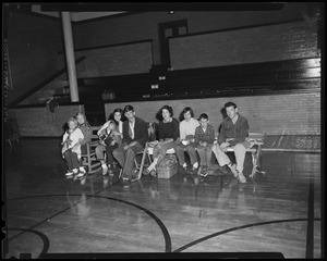 Group of people seated in a gymnasium