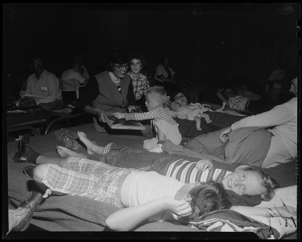 Families using cots in shelter after hurricane Digital Commonwealth