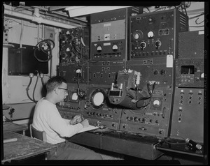 Man sitting in front of equipment