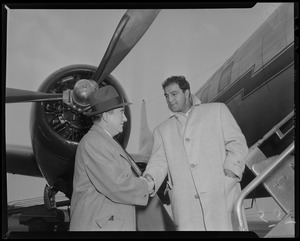 Sam Silverman and Rocky Marciano as one arrives by plane