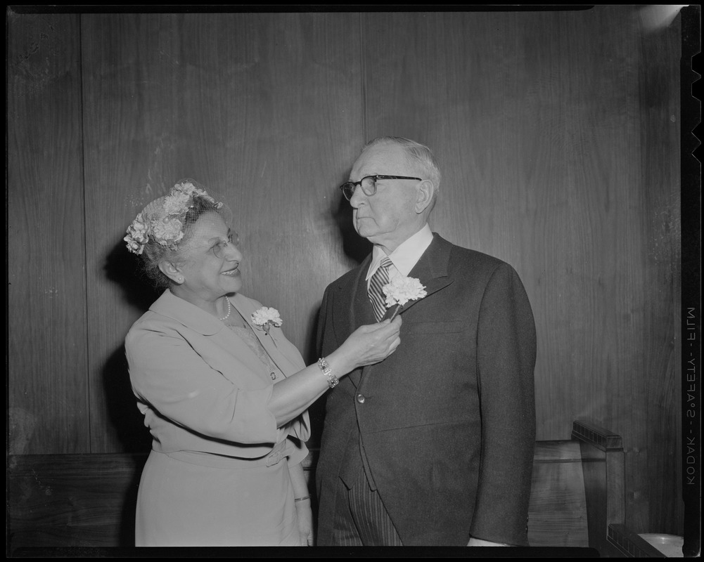 Judge Jennie Loitman Barron fixing a man's boutonnière