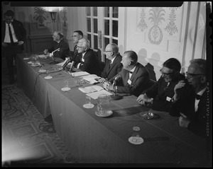 Panel discussion with seven men seated at a table. Dr. Albert B. Sabin is seated third from the left