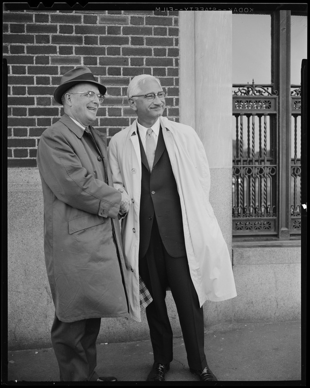 Dr. Albert B. Sabin (right) and Leo Dunphy, chapter chairman of the National Foundation shaking hands