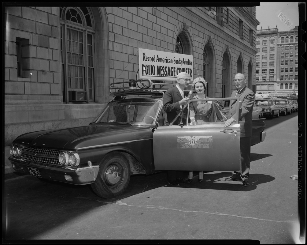 Dr. Albert B. Sabin (far left) and two others stand beside the Record American-Sunday Advertiser Polio Message Cruiser