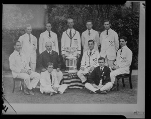 Group shot of team (including Gov. Leverett Saltonstall) with older man and crew cup