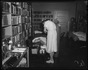 Nurse caring for a man in library