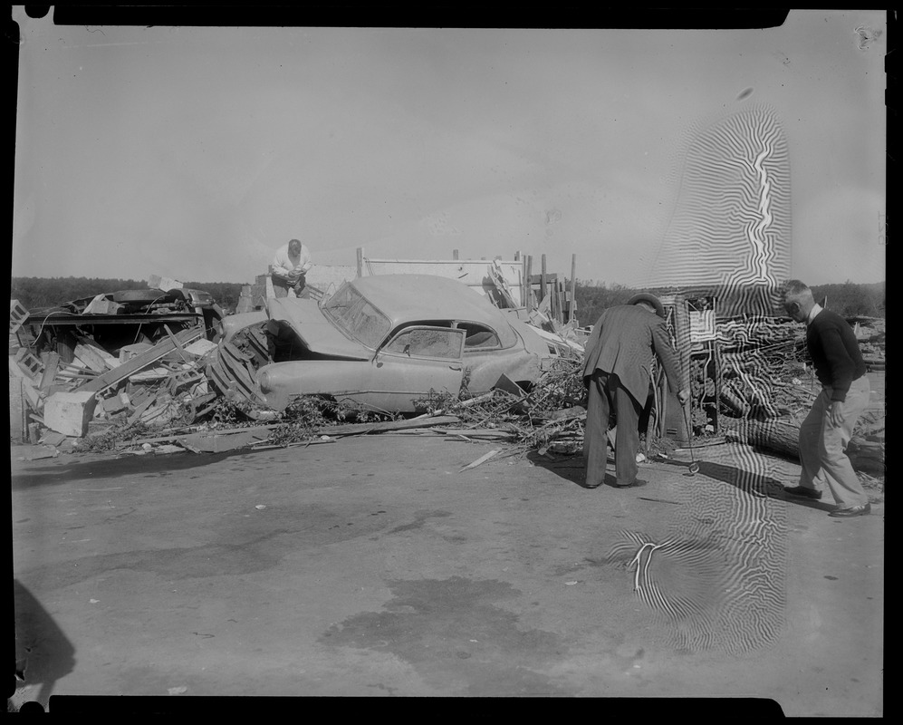 People by ruined building