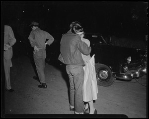Man embracing a woman