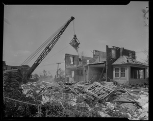 Crane amid destructed homes
