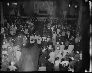 Religious ceremony with clergy walking down the aisle