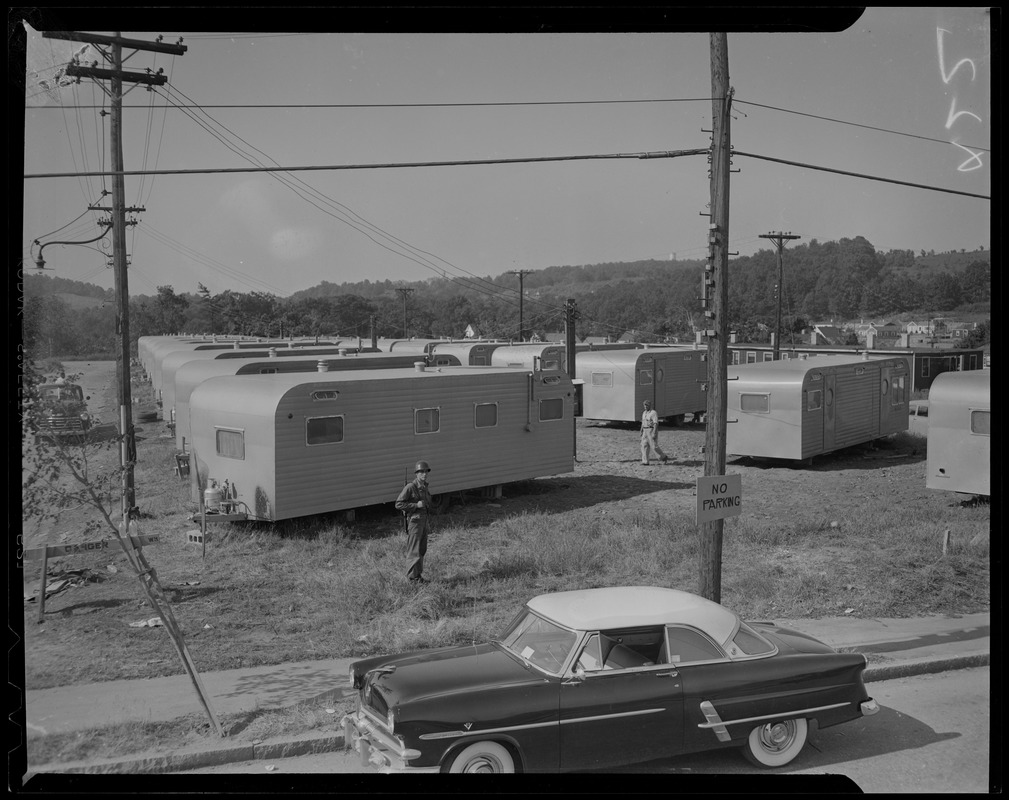 Military man among trailers