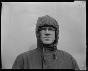 Man wearing a hood and glasses