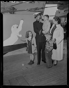 Navy officer with two sons, daughter, and wife, walking the ship