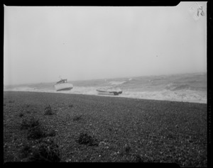 Two boats along stormy coastline