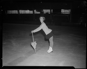Barbara Ann Scott on skates, with umbrella pointed down