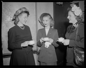 Barbara Ann Scott with two women in conversation and holding teacups