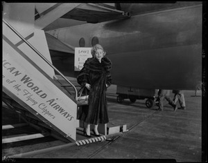 Zsa Zsa Gabor at the bottom of plane stairs