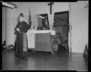 Archbishop Richard J. Cushing in front of a truck, turned altar