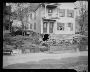 View of a house with debris in front