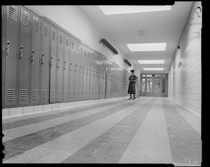 Woman standing at locker