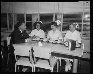 Rep. Harry Coltun talking to nurses Maryanne Aston, Joan Gillis and Kay Allen
