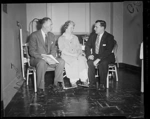 Reps. Charles Gibbons and John T. Tynan sitting with patient Mrs. Margaret Foy