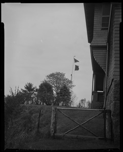 View of flagpole with signal flags blowing