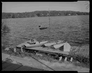 Damaged dock with sailboats