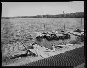 Damaged boat dock with boats