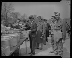 Leverett Saltonstall walking through a military buffet serving line